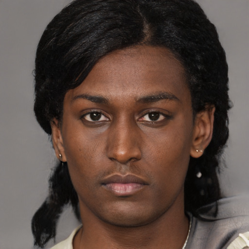 Neutral black young-adult female with medium  black hair and brown eyes