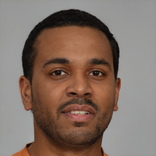 Neutral black young-adult male with short  brown hair and brown eyes