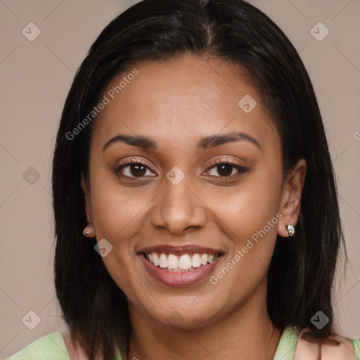 Joyful latino young-adult female with medium  brown hair and brown eyes