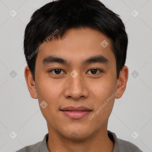 Joyful asian young-adult male with short  black hair and brown eyes