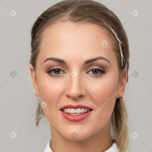 Joyful white young-adult female with medium  brown hair and grey eyes