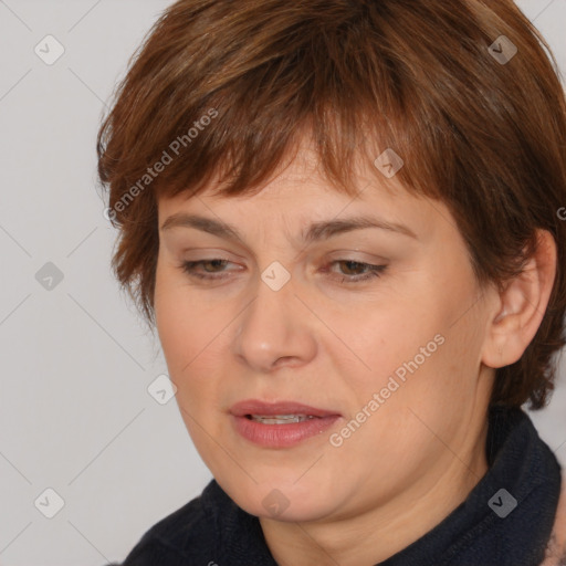 Joyful white adult female with medium  brown hair and brown eyes