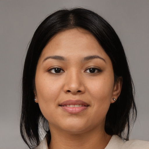 Joyful asian young-adult female with medium  black hair and brown eyes