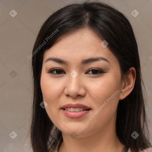 Joyful asian young-adult female with long  brown hair and brown eyes