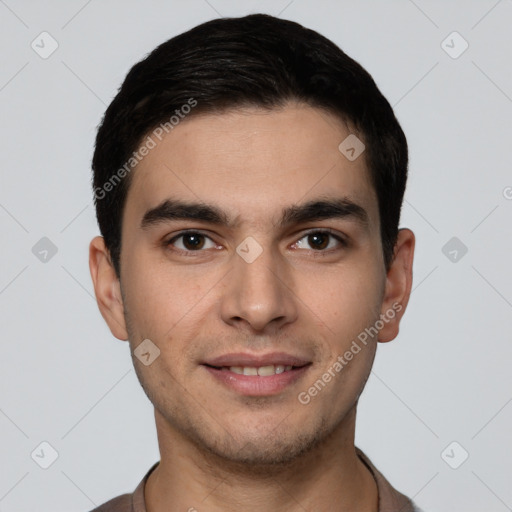 Joyful white young-adult male with short  black hair and brown eyes