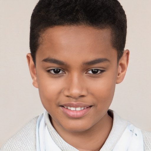 Joyful black child male with short  brown hair and brown eyes