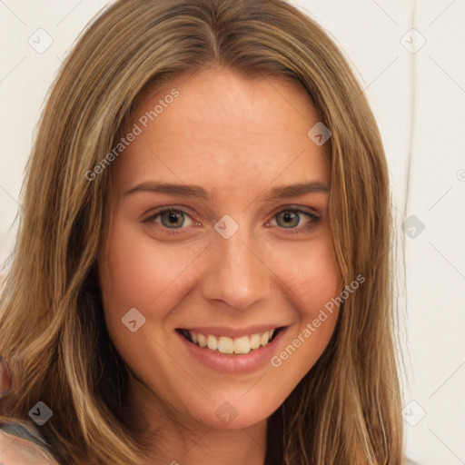 Joyful white young-adult female with long  brown hair and green eyes