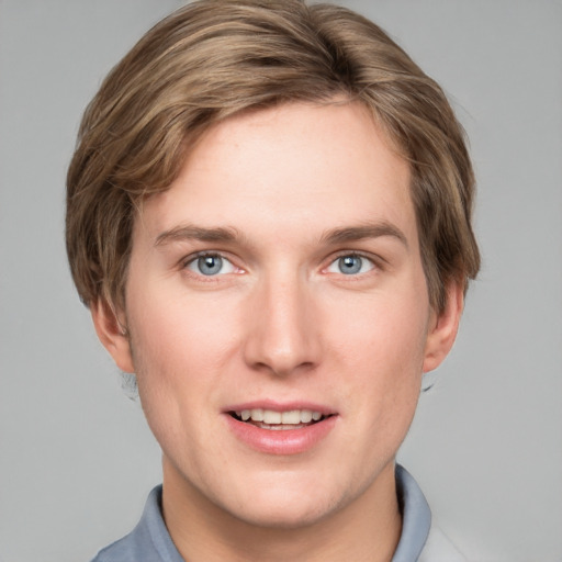 Joyful white young-adult male with short  brown hair and blue eyes