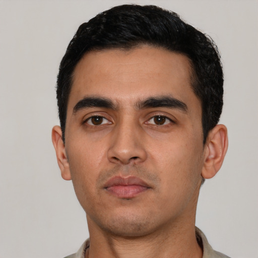 Neutral latino young-adult male with short  black hair and brown eyes