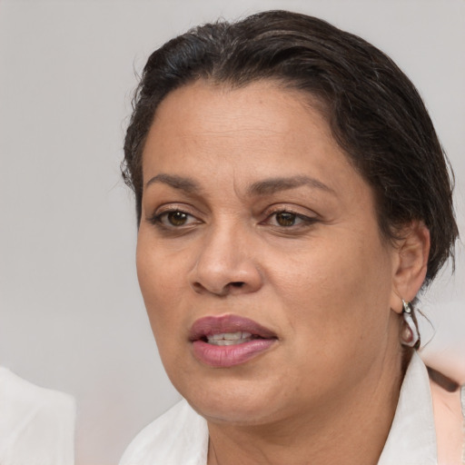 Joyful white adult female with short  brown hair and brown eyes
