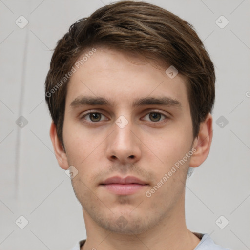 Neutral white young-adult male with short  brown hair and grey eyes