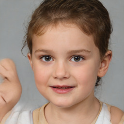 Joyful white child female with short  brown hair and brown eyes