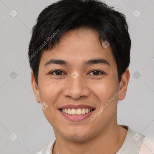 Joyful asian young-adult male with short  brown hair and brown eyes
