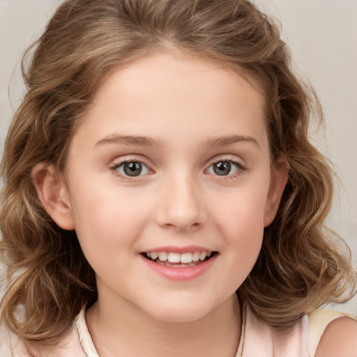 Joyful white child female with long  brown hair and brown eyes