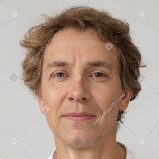 Joyful white middle-aged male with short  brown hair and brown eyes