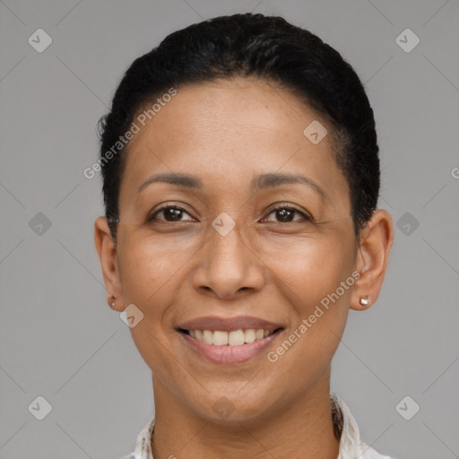 Joyful black adult female with short  black hair and brown eyes