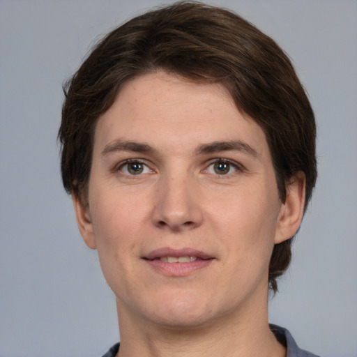 Joyful white young-adult male with medium  brown hair and brown eyes