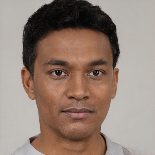 Neutral latino young-adult male with short  black hair and brown eyes