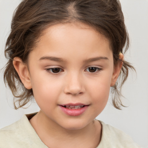 Joyful white child female with medium  brown hair and brown eyes