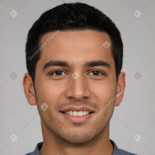 Joyful latino young-adult male with short  brown hair and brown eyes