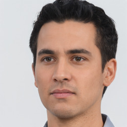 Neutral white young-adult male with short  black hair and brown eyes