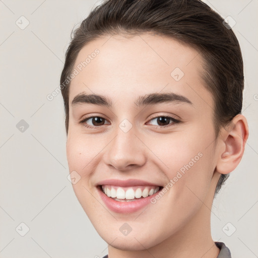 Joyful white young-adult female with short  brown hair and brown eyes