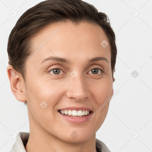 Joyful white young-adult female with short  brown hair and brown eyes