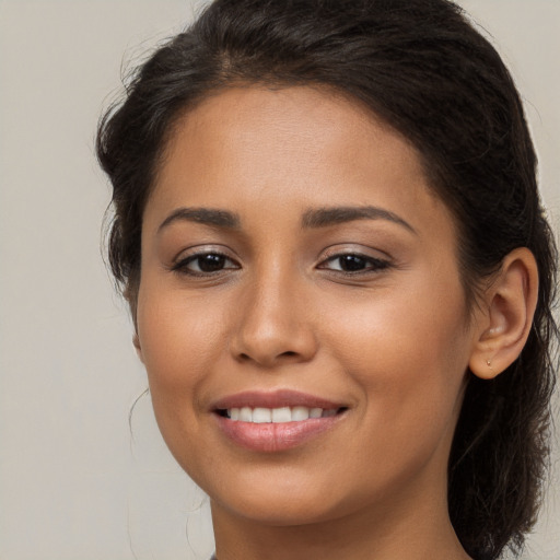 Joyful white young-adult female with long  brown hair and brown eyes