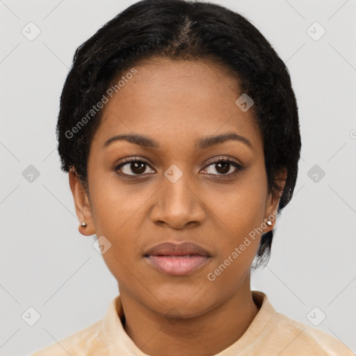 Joyful black young-adult female with short  black hair and brown eyes