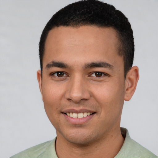 Joyful white young-adult male with short  black hair and brown eyes