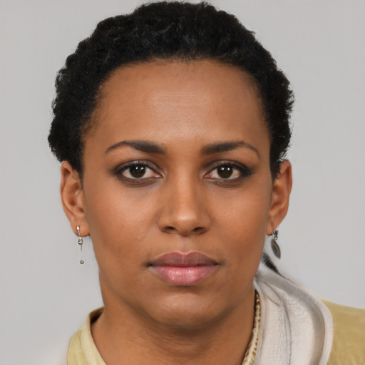 Neutral latino young-adult female with short  brown hair and brown eyes