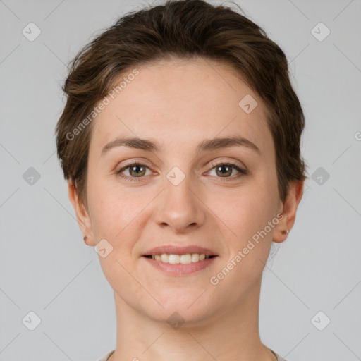 Joyful white young-adult female with short  brown hair and grey eyes