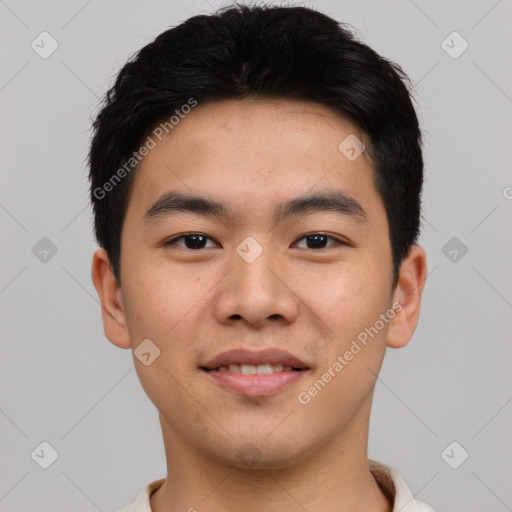 Joyful asian young-adult male with short  black hair and brown eyes