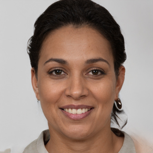 Joyful white adult female with short  brown hair and brown eyes