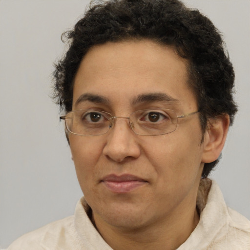 Joyful latino adult female with short  brown hair and brown eyes