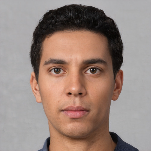 Neutral white young-adult male with short  black hair and brown eyes