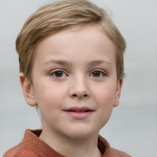 Joyful white child female with short  brown hair and blue eyes