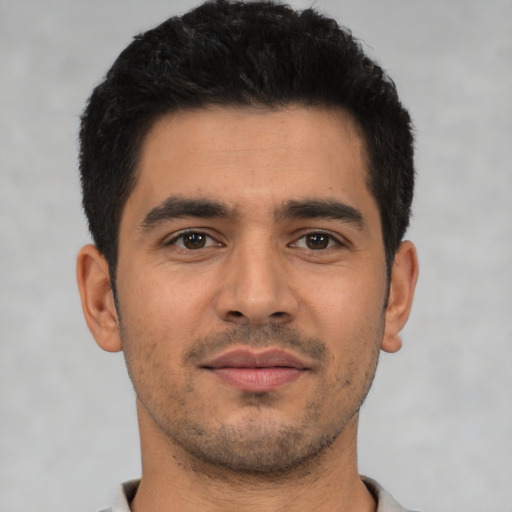 Neutral latino young-adult male with short  brown hair and brown eyes