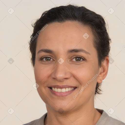 Joyful white adult female with short  brown hair and brown eyes