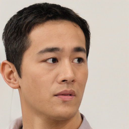 Neutral asian young-adult male with short  brown hair and brown eyes