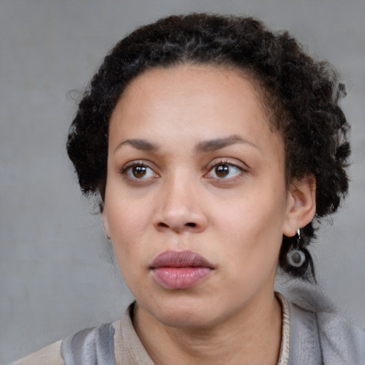 Neutral black young-adult female with short  brown hair and brown eyes