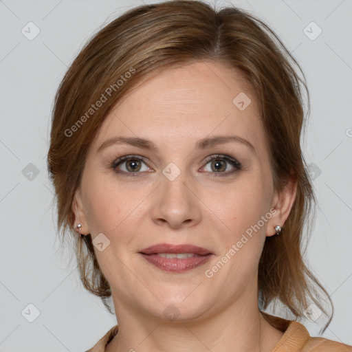 Joyful white adult female with medium  brown hair and grey eyes