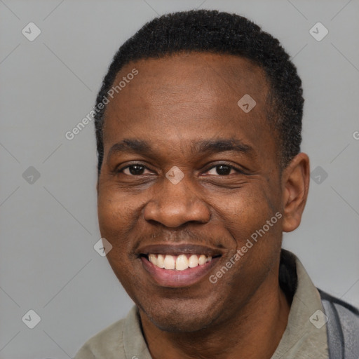 Joyful black adult male with short  black hair and brown eyes