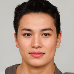 Joyful asian young-adult male with short  brown hair and brown eyes