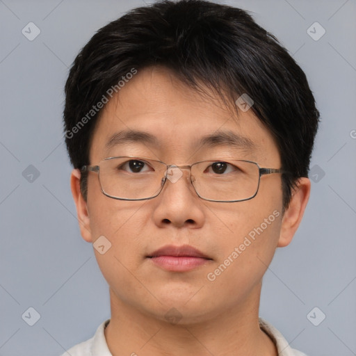 Neutral asian adult male with short  brown hair and brown eyes