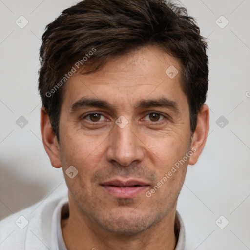 Joyful white adult male with short  brown hair and brown eyes