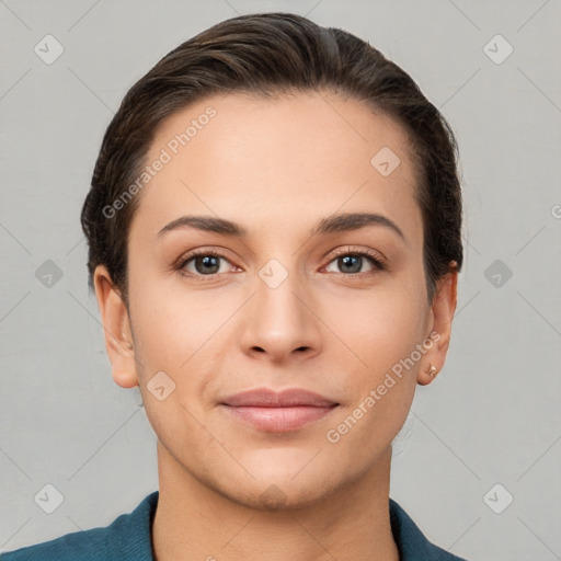 Joyful white young-adult female with short  brown hair and brown eyes