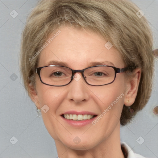 Joyful white adult female with medium  brown hair and blue eyes