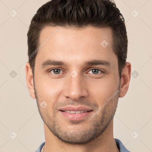 Joyful white young-adult male with short  brown hair and brown eyes