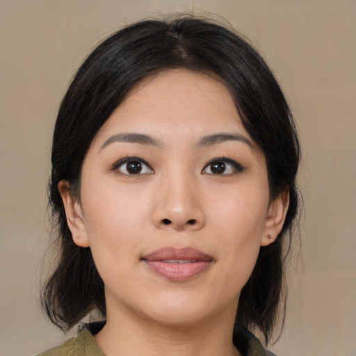 Neutral asian young-adult female with medium  brown hair and brown eyes